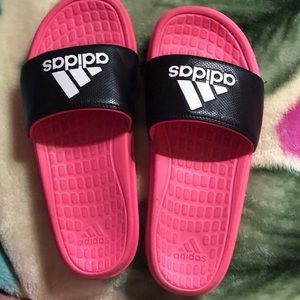 Hot pink and black adidas slides